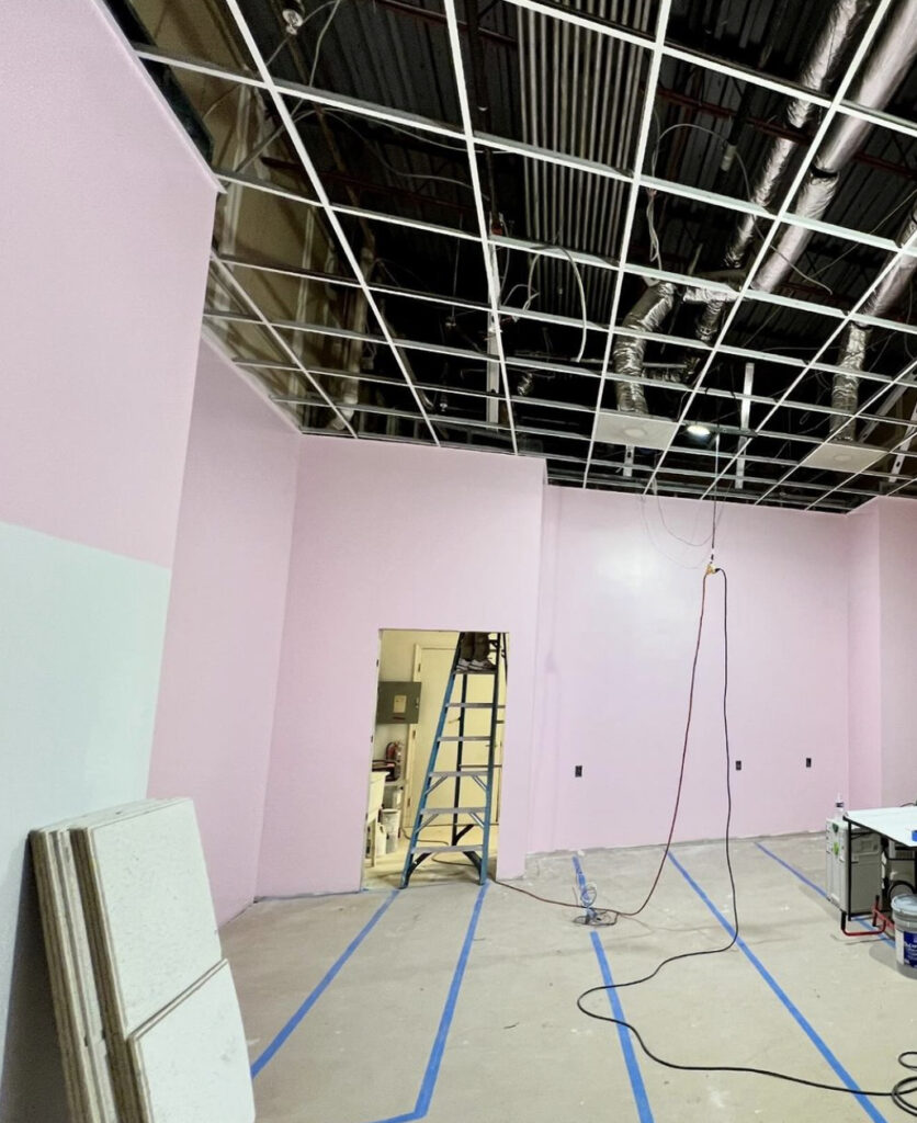 pink storefront under construction